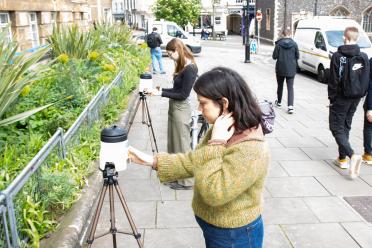 PhD researchers Mia and Jade setting up air samplers outside City Hall in Norwich